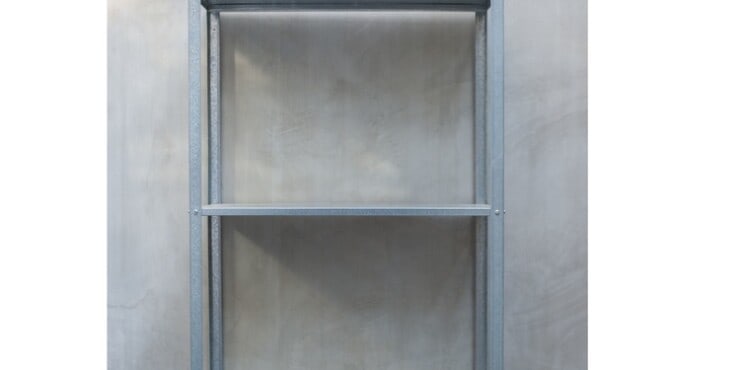 a shelf with a metal surface