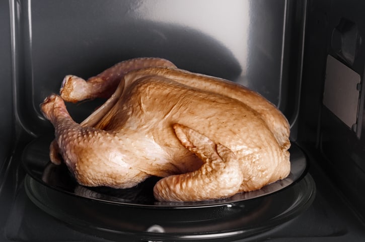 A cooked chicken in the microwave